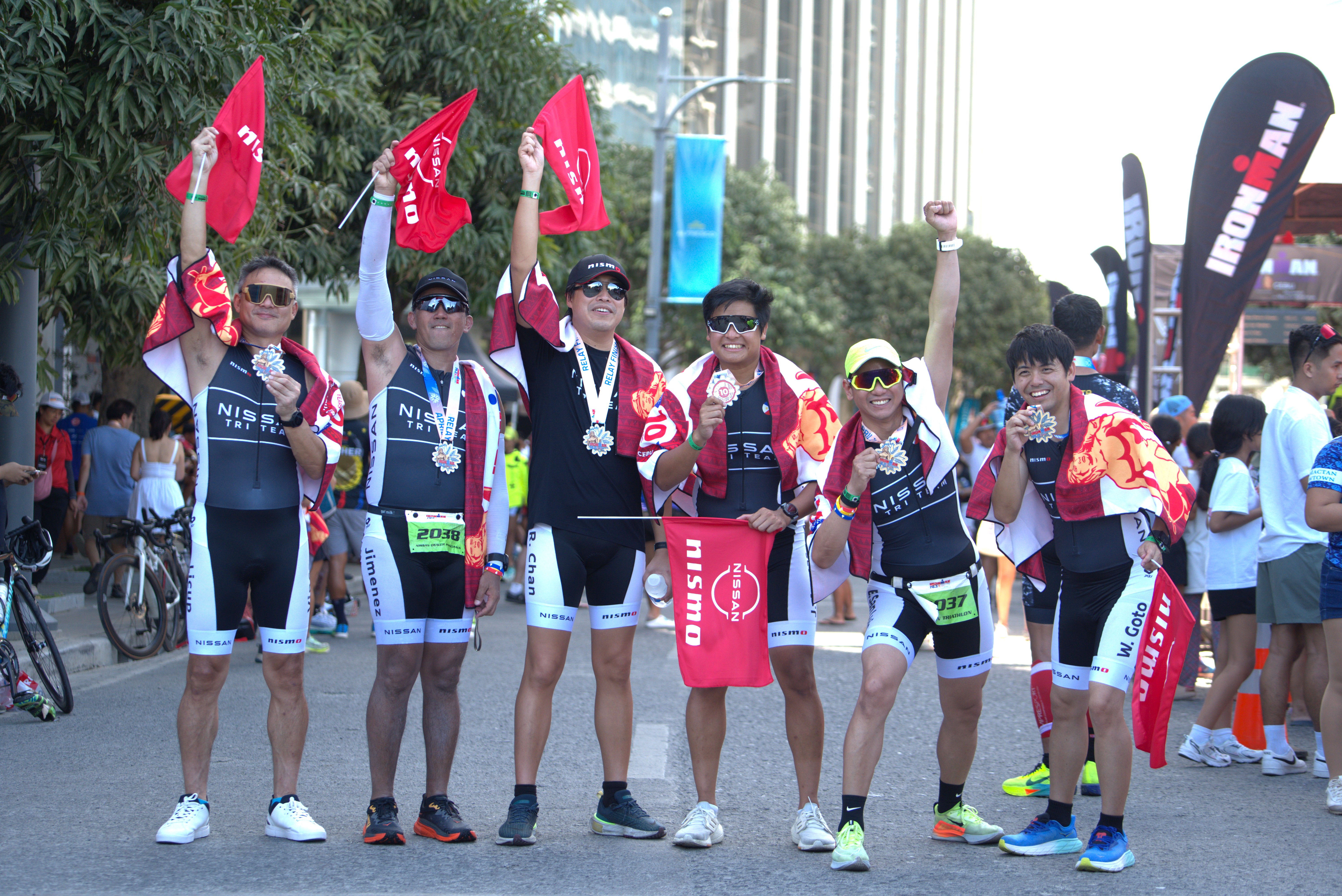 The Nissan Dealer Principals and Employee groups after completing the race